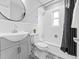 Contemporary bathroom with patterned tile flooring, modern fixtures, and a shower-tub combo at 3630 Magnolia St, Denver, CO 80207