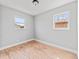 Well-lit bedroom with two windows and attractive hardwood flooring at 3630 Magnolia St, Denver, CO 80207