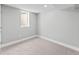 Neutral bedroom features a single window, neutral paint, and carpeting at 3630 Magnolia St, Denver, CO 80207