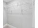 Empty closet with white wire shelving and light grey carpet, offering ample storage space at 3630 Magnolia St, Denver, CO 80207
