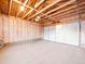 Spacious garage with high ceiling and exposed beams, ready for customization and storage at 3630 Magnolia St, Denver, CO 80207