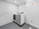 Bright laundry room featuring front load washer and dryer at 3630 Magnolia St, Denver, CO 80207