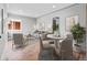 Open concept living and dining room with modern furnishings and neutral color palette, creating a serene space at 3630 Magnolia St, Denver, CO 80207