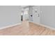Refinished hardwood floors flow through this living space towards the kitchen, offering a modern design at 3630 Magnolia St, Denver, CO 80207