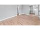 Spacious living room with refinished hardwood floors and neutral paint, ready for personalization at 3630 Magnolia St, Denver, CO 80207