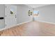 Bright living area featuring refinished hardwood floors, neutral paint, and a large window for ample natural light at 3630 Magnolia St, Denver, CO 80207