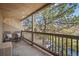 Relaxing balcony with seating and a view of lush trees and natural scenery at 14751 E Tennessee Dr # 228, Aurora, CO 80012
