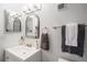 Modern bathroom featuring a framed mirror, updated vanity, brushed nickel fixtures, and stylish decorative touches at 14751 E Tennessee Dr # 228, Aurora, CO 80012