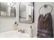 Stylish bathroom with a modern mirror, elegant faucet, and decorative accents at 14751 E Tennessee Dr # 228, Aurora, CO 80012