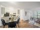 Bright kitchen with gray cabinets, modern appliances, breakfast bar, and adjacent dining area with seating for four at 14751 E Tennessee Dr # 228, Aurora, CO 80012