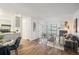 Bright living room featuring modern fireplace, balcony access, and wood-look flooring at 14751 E Tennessee Dr # 228, Aurora, CO 80012
