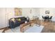 Comfortable living room featuring modern furniture and decor on light-colored flooring at 14751 E Tennessee Dr # 228, Aurora, CO 80012