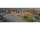Panoramic view of a vast open space with meandering paths and trees bordered by residential neighborhoods at 14751 E Tennessee Dr # 228, Aurora, CO 80012
