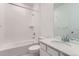 Well-lit bathroom with a tub-shower combination, white subway tiles, and a sleek vanity at 16622 E 109Th Ave, Commerce City, CO 80022