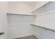 Walk-in closet with ample shelving and a neutral carpet, providing efficient storage solutions at 16622 E 109Th Ave, Commerce City, CO 80022