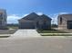 Charming single-story home with well-manicured lawn and attached two-car garage at 16622 E 109Th Ave, Commerce City, CO 80022