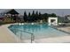 Inviting community pool with lounge chairs and lifeguard stands, perfect for relaxation and recreation at 16622 E 109Th Ave, Commerce City, CO 80022