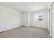 Bright bedroom with large window and carpet flooring at 24709 E 39Th Ave, Aurora, CO 80019