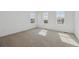 Bright bedroom with three large windows that provide plenty of natural light at 24709 E 39Th Ave, Aurora, CO 80019