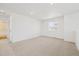 Spacious bedroom with large window and neutral carpet at 24709 E 39Th Ave, Aurora, CO 80019