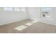 Bright bedroom with neutral carpet and a large window allowing ample natural light at 24709 E 39Th Ave, Aurora, CO 80019