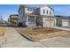 Charming two-story home with a two car garage, a front porch, and professionaly landscaped yard at 24709 E 39Th Ave, Aurora, CO 80019