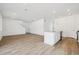 Spacious open-concept layout with hardwood floors and tons of natural light flowing through the living spaces at 24709 E 39Th Ave, Aurora, CO 80019