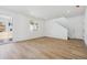 Bright living room with light wood flooring, recessed lighting, and large windows at 24709 E 39Th Ave, Aurora, CO 80019
