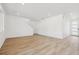 A bright living room with lots of natural light, light wood flooring, white walls, and an open floorplan at 24709 E 39Th Ave, Aurora, CO 80019