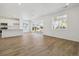 Expansive living room features lots of space, hardwood floors, and sliding door access to the backyard at 24709 E 39Th Ave, Aurora, CO 80019