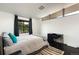 Cozy bedroom with a comfortable bed, stylish decor, and a desk area, perfect for relaxation at 8 Lindenwood Dr, Littleton, CO 80120