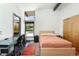 Bright bedroom features a modern aesthetic, ample natural light, and a comfortable layout at 8 Lindenwood Dr, Littleton, CO 80120