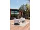 Inviting deck area featuring modern white chairs and outdoor seating with scenic views at 8 Lindenwood Dr, Littleton, CO 80120