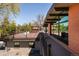 Outdoor deck with railings and outdoor seating at 8 Lindenwood Dr, Littleton, CO 80120