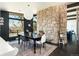 Dining room with a modern table setting and views from the large windows at 8 Lindenwood Dr, Littleton, CO 80120