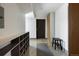 Hallway with neutral paint, storage, and accent bench at 8 Lindenwood Dr, Littleton, CO 80120
