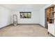 A versatile room featuring neutral carpet, natural light, and modern accents for varied use at 8 Lindenwood Dr, Littleton, CO 80120