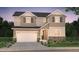 Charming two-story home featuring stone accents, a two-car garage, and manicured landscaping at 2197 S Jackson Gap St, Aurora, CO 80018