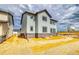 New construction home with stone accents, light siding, and dark trim under a cloudy sky at 2197 S Jackson Gap St, Aurora, CO 80018