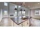 Modern kitchen with stainless steel appliances, granite countertops, and pendant lighting at 2197 S Jackson Gap St, Aurora, CO 80018