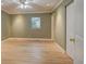 Empty bedroom featuring hardwood floors, a window, and neutral paint at 1275 Fairfax St, Denver, CO 80220