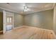 Empty bedroom with hardwood floors, crown molding, a ceiling fan, and natural light at 1275 Fairfax St, Denver, CO 80220