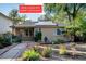 Charming ranch home featuring solar panels and a beautifully landscaped front yard at 1275 Fairfax St, Denver, CO 80220