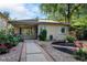 Charming brick home featuring a well-maintained front yard with lovely landscaping and walkway at 1275 Fairfax St, Denver, CO 80220