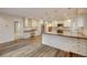 Bright kitchen features white cabinets, granite countertops and stainless steel appliances at 1275 Fairfax St, Denver, CO 80220