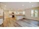 Bright kitchen featuring updated countertops, modern appliances, and wood flooring at 1275 Fairfax St, Denver, CO 80220