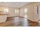 Open living room features wood floors and sliding glass doors for easy outdoor access at 1275 Fairfax St, Denver, CO 80220