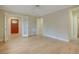 Open living area boasting hardwood floors, a decorative door, and ample natural light at 1275 Fairfax St, Denver, CO 80220