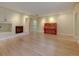 Spacious living area boasts hardwood floors, recessed lighting, and a cozy fireplace at 1275 Fairfax St, Denver, CO 80220