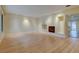 Expansive living room with sleek hardwood floors and fireplace, offering a bright, open space at 1275 Fairfax St, Denver, CO 80220